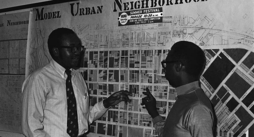 two men with Model Urban Neighborhood map