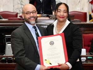 Professor Jackson holding his honorary citation with Senator Jill Carter