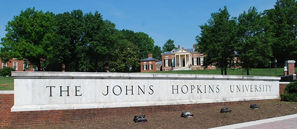 Photo of Johns Hopkins University sign and lawn