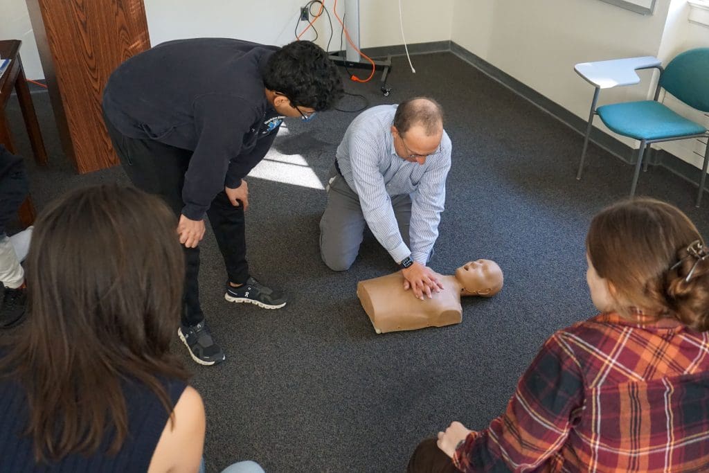 CPR training compressions on dummy