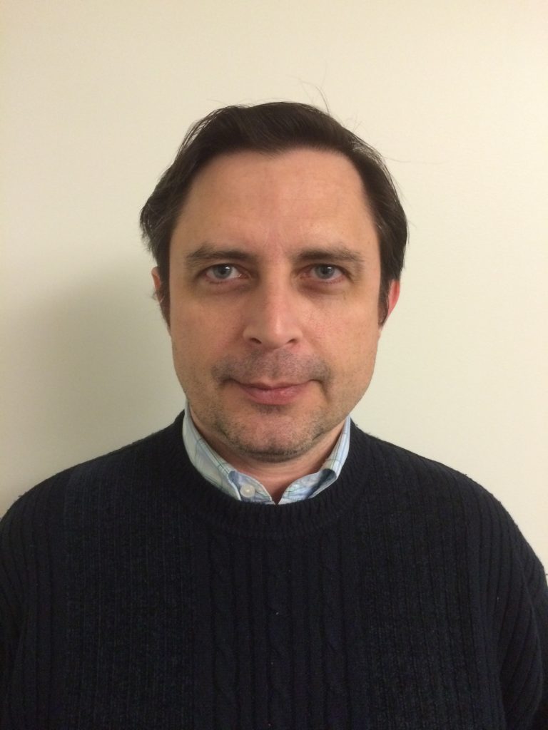 A headshot photo of Dr. Alex Popov