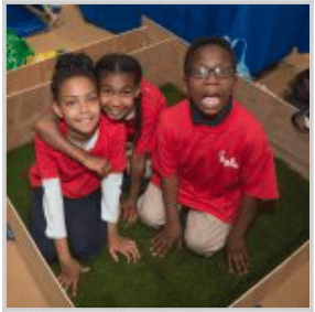 three kids in red shirts