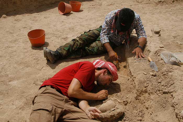 Excavating post-Bronze Age burials on High Mound South Slope.