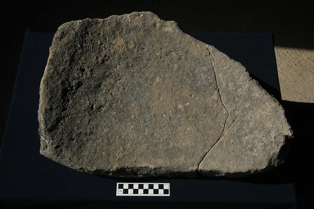 Synthetic basalt grinding stone