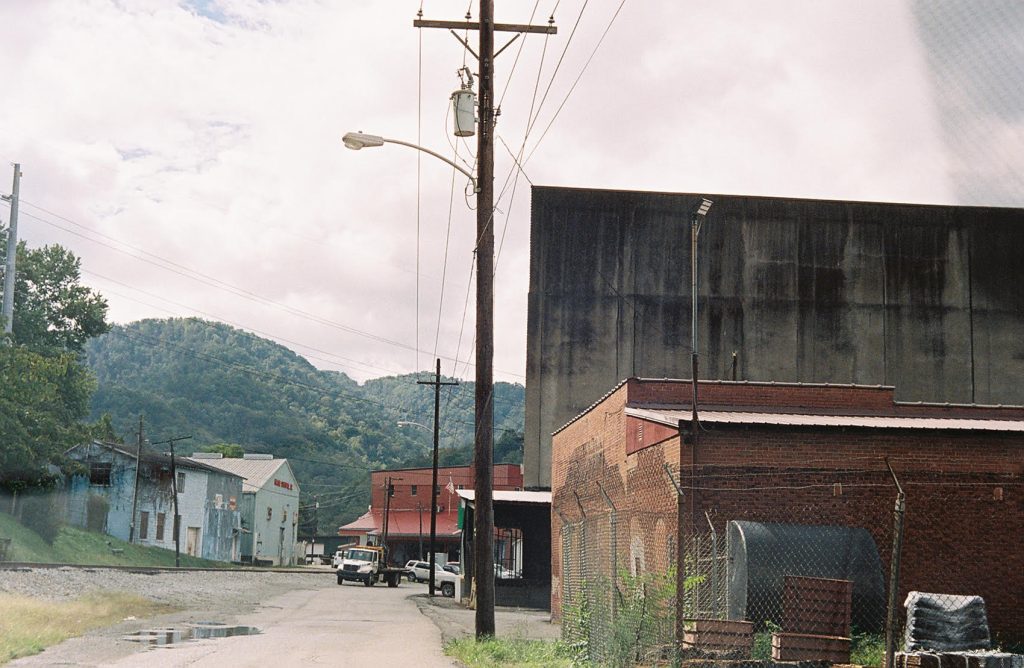 Scene of dilapidated buildings against cloudy sky in Vicco, Kentucky