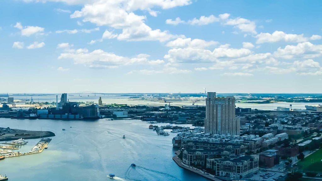 the Baltimore harbor from above, with skyscrapers and buildings around the edge