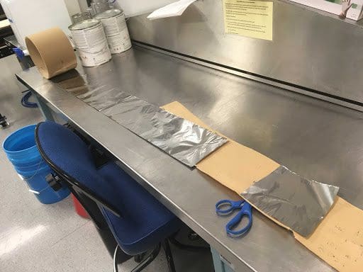lab table with long piece of foil
